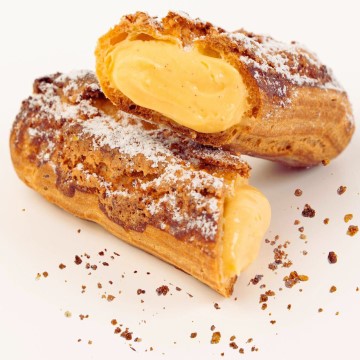 t is a snack or dessert item from Le Pont Patisserie that specializes in puff pastry products. Tags include food, baked goods, gluten, powdered sugar, baking, cuisine, and bakery.