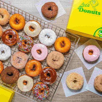 The image is of a tray of donuts from Lee's Donuts. It features various types of donuts and is tagged as a snack, baked goods, dessert, and more.