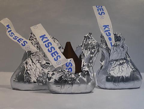 The image is the kisses chocolates. The content includes text that mentions "KISSES" and "ALAN KILBURN art." The image may be related to candy or food based on the tags provided.