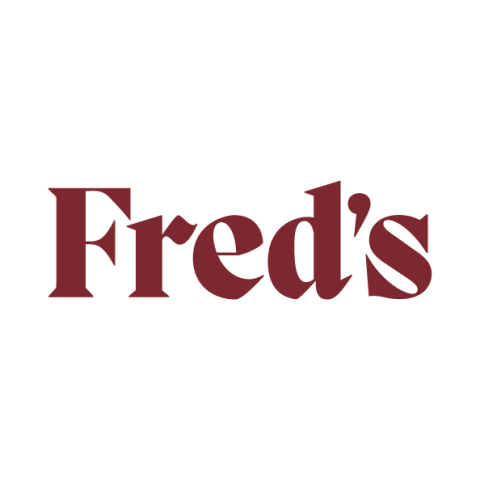 The image is a logo for Fred's restaurant. It features the text "Fred's" in a stylized font, showcasing graphic design and typography elements.