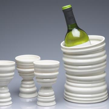 porcelain ceramics by Hitomi Mckenzie, including a porcelain wine cooler and goblets.