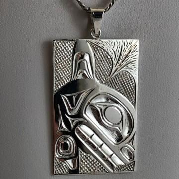 It is tagged as art, fashion accessory, pendant, wall, silver, indoor, necklace, and jewelry. Additional context mentions Keith Kerrigan Haida indigenous jewelry and a whale pendant.