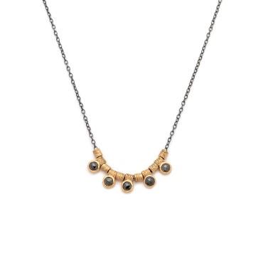 The image is of a necklace featuring a stone pendant. It is a piece of jewelry from Lulu Fiedler Contemporary, focusing on fashion and accessory trends.