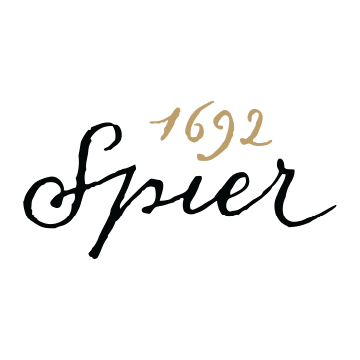 The image features a shape resembling an arrow with the text "1692" and "Spier" written inside. It is related to the Spier Winery logo and includes elements of handwriting, calligraphy, font, and typography.