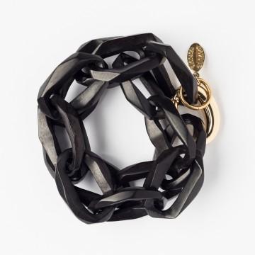 The image is a black and silver bracelet designed by Tania Gleave Jewelry. It is tagged as a fashion accessory and bracelet.